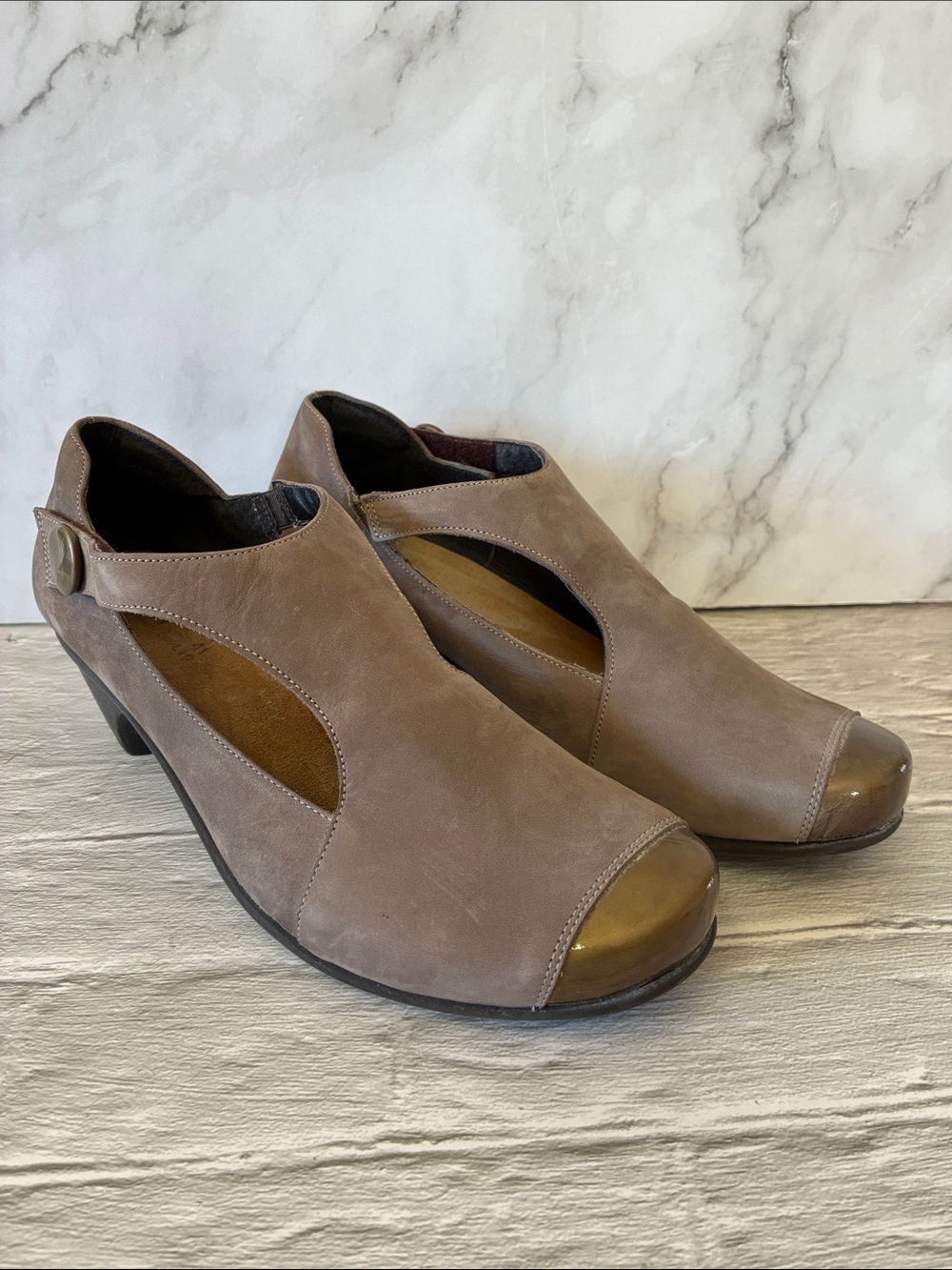 Naot Taupe Cutout Nubuck Leather Wedge Mary Janes With Metallic Bronze Toe Cap